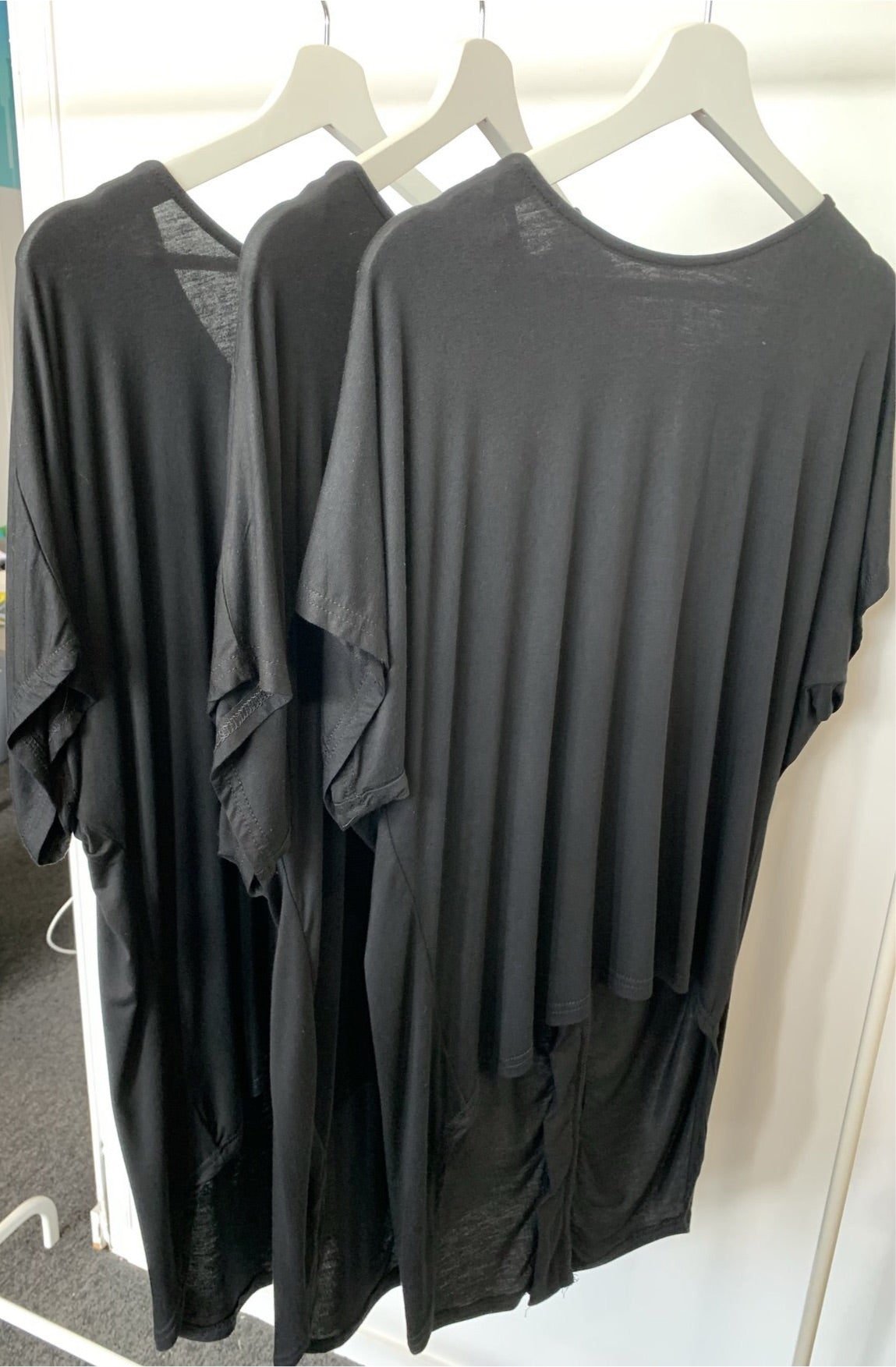 Silver Wishes Asymmetric Hemline Black Top with Double Zip at the back