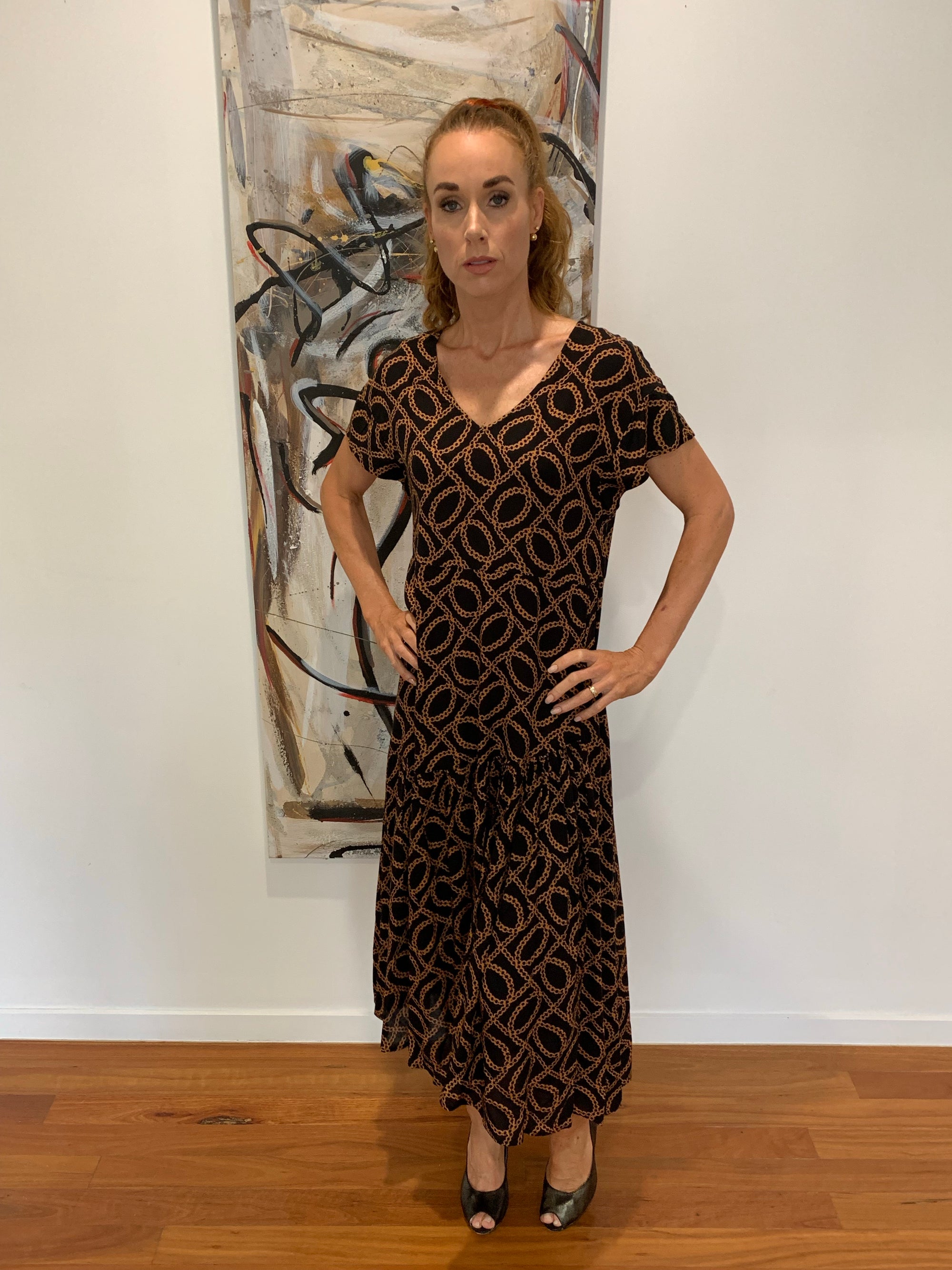 Midi Long Low Hemline Dress in Black with Burnt Orange Chain Print from Willow Tree