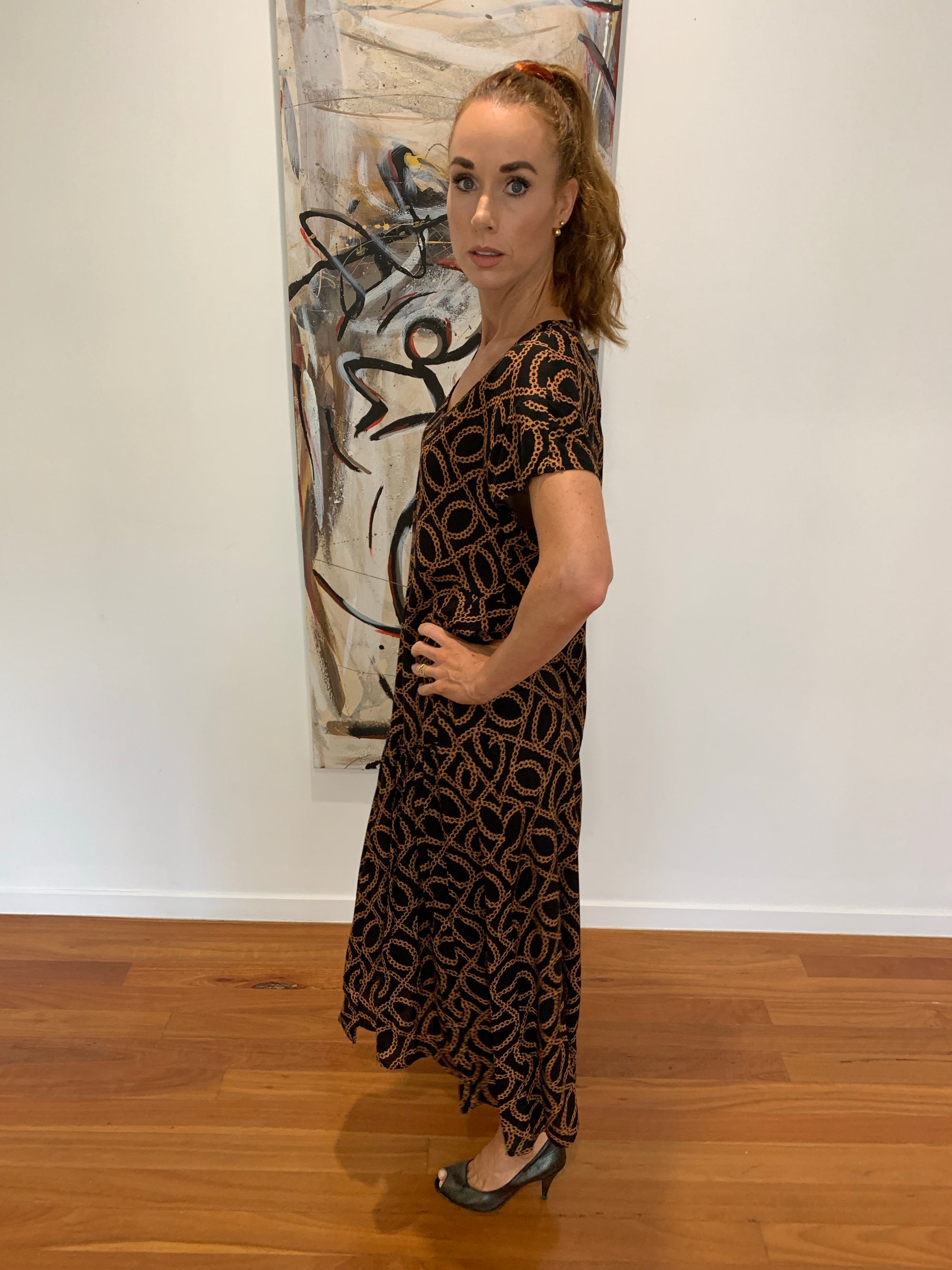 Midi Long Low Hemline Dress in Black with Burnt Orange Chain Print from Willow Tree